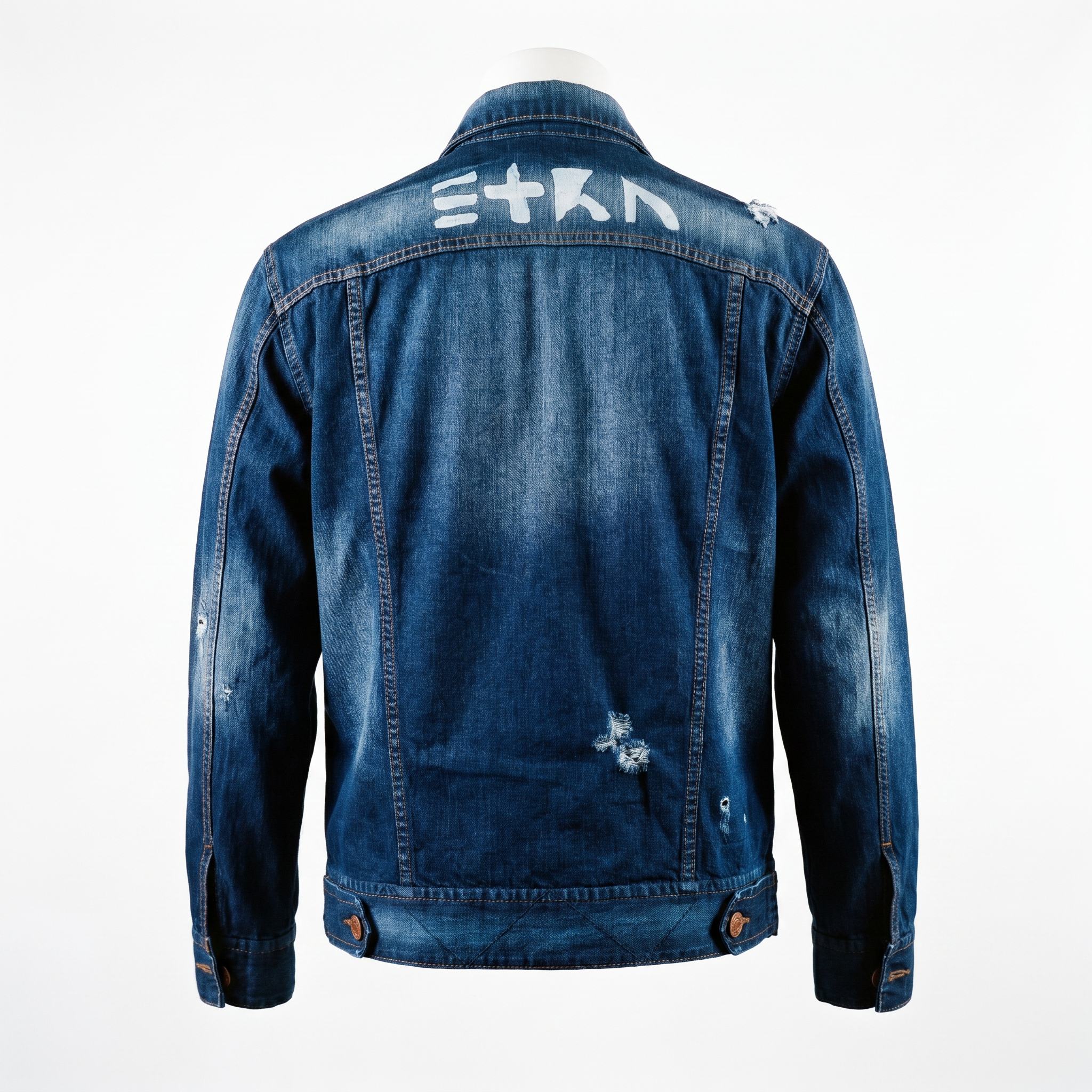 Back view of the unconventionally constructed ETRN denim jacket, demonstrating the structured streetwear fit and engineered tailoring for men. Features the brand name 'ETRN' printed across the upper back.