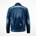 Back view of the unconventionally constructed ETRN denim jacket, demonstrating the structured streetwear fit and engineered tailoring for men. Features the brand name 'ETRN' printed across the upper back.