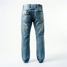 A pair of blue ETRN denim jeans shown from the back, featuring a button closure, zippered back pockets, and a faded wash.